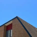 A minimalist view of a modern building facade against a clear blue sky in North Wollongong, NSW, Australia.